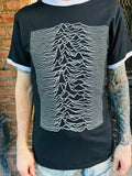 Joy Division Ringer black t-shirt with white trim on neck and sleeves featuring unknown pleasures album artwork, on a model.