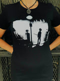 The Cure Exorcist black t-shirt with image of Robert Smith holding a guitar in style of the movie The Exorcist, photographed on a model.