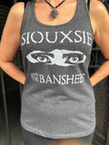 Siouxsie and the Banshees grey tank top featuring the iconic eyes logo and band name in white, photographed on a model.