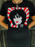 Siouxsie Sioux black t-shirt featuring a black and white illustration of her face with red lips set on a white and red rising sun background and stylized "Siouxsie" in the bottom of the image, photographed on a model.