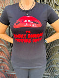Rocky Horror Picture Show black t-shirt featuring the red lips and name from the movie artwork, photographed on a model.