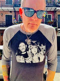 Ozzy Osbourne and Lemmy Kilmister black raglan t-shirt with heather grey 3/4 sleeves featuring a black and white image of them sticking up their middle fingers, on a model.