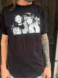 Black Ozzy Osbourne and Lemmy Kilmister t-shirt featuring a black and white image of both of them sticking up their middle fingers, on a model.