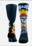 Colorful socks with Ghost logo and Papa graphic designs on a black fabric background.