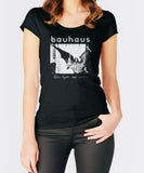 Person wearing a black t-shirt with 'bauhaus' design on a white background
