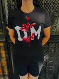 Person wearing a black t-shirt with red rose and white DM graphic design