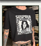 Black t-shirt with 'Suspiria' graphic design featuring a person's face.