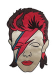 Embroidered patch of David Bowie's face with his signature red and blue lightning bolt makeup, styled with red hair, photographed on a white background.