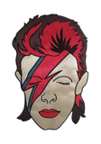 Embroidered patch of David Bowie's face with his signature red and blue lightning bolt makeup, styled with red hair.