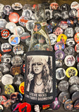 Coozie with image of Stevie Nicks with the text "Stevie Nicks is My Fairy Godmother" in white across the bottom, photographed on top of a bunch of band pins.