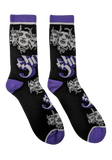 A pair of black crew socks with purple and white graphic prints, featuring a repeating Papa face and the Ghost logo.