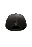 Back of black Ghost baseball hat with a yellow logo symbol on the back,  displayed on a white background.