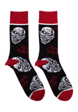 A pair of black crew socks featuring the album art of Iron Maiden's 'Piece of Mind' album, with red cuffs, heels, and toes, and white zombie graphics.