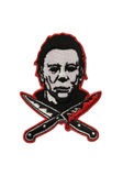 Halloween Movie Franchise embroidered patch featuring Michael Myers face in black-and-white with a red outline, positioned above two crossed knives with blood dripping and outlined in red.