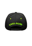Black Type O Negative baseball cap shown from the back, featuring bright green embroidered text reading 'Dead Again' and matching green eye details on the back panels, displayed on a translucent background.