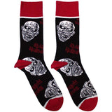 A pair of black and red socks with a repeating zombie design and the text 'IRON MAIDEN'.