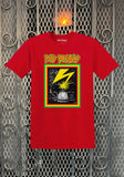 A red short-sleeve t-shirt featuring a 'Bad Brains' Banned in DC band graphic on the front, displayed against a decorative metal gate background.
