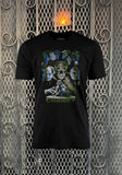 Chaney Family Legends black t-shirt featuring a collage of the various Chaney monsters along with the text 'the first family of horror Chaney' in green across the bottom, displayed on a metal gate background.