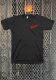 Front of The Clash Logo black t-shirt featuring a small 'The Clash' logo in red on the left chest, displayed on a metal gate background.