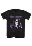 The Crow Purple Eric Draven black t-shirt featuring the movie logo in purple and a black and white image of Eric on a purple and black background, displayed against a white background.
