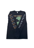 Sleeve detail on black long sleeve The Crow Type O Negative t-shirt with 'The Crow' graphic outline in orange and stylized white text 'The Crow' down the right sleeve and stylized white text 'Can't Rain All The Time' down the left sleeve, displayed on a white background.