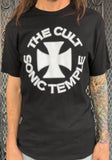 The Cult Sonic Temple black t-shirt featuring a large iron cross with 'The Cult Sonic Temple' text around it in white, on a model against a metal gate background.