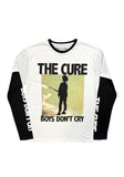A long-sleeve graphic t-shirt by The Cure featuring a white body, black collar and sleeves, and a central graphic of a Robert Smith silhouette with the text 'THE CURE BOYS DON'T CRY'.