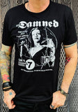 The Damned Vampira black t-shirt featuring the album artwork, photographed on a model in front of a metal gate.