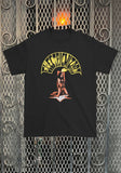 Front of Electric Wizard Sabbath black t-shirt featuring album artwork, displayed on a metal gate background.