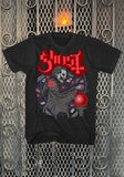 Ghost Dealer's Luck black t-shirt featuring artwork from the album and the band name logo in red and burgundy text, displayed on a metal gate background.