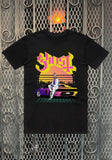 Ghost Miami Vice black t-shirt featuring a large band logo in bright pink and yellow font along with a colorful illustration of Papa in a Miami Vice setting leaning on a car, displayed on a metal gate background.