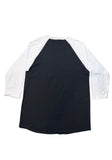 Back of a raglan-style baseball t-shirt with a black body and white three-quarter sleeves, laid flat against a white background.
