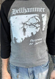 Hellhammer Triumph of Death heather grey raglan t-shirt with black 3/4 sleeves featuring album artwork, on a model against a metal gate background.