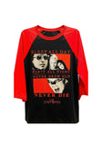 The Lost Boys black raglan t-shirt with red 3/4 sleeves featuring the movie imagery along with red text that reads "Sleep all day Party all night Never grow old Never die The Lost Boys", photographed flat on a white background.