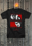 The Lost Boys black t-shirt featuring the movie imagery along with the words "Sleep all day Party all night Never grow old Never Die The Lost Boys", photographed flat on a metal gate background.