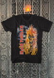 Iron Maiden Debut Record black t-shirt featuring album artwork, displayed on a metal gate background.