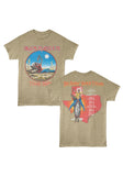 A heathered tan graphic t-shirt showing both front and back views. The front features a circular graphic with the text 'IRON MAIDEN' and 'TEXAS 1982' in red, surrounding a desert scene with Eddie and the sun.