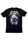 Back of Metallica Kill 'Em All black t-shirt featuring an illustration of a figure in an electric chair being electrocuted and the band logo in black with a white background above it, displayed on a white background.