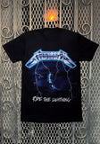 Front of Metallica Ride the Lightning black t-shirt featuring artwork from the album, displayed on a metal gate background.