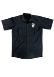 Front of Misfits Crimson Ghost black button down short sleeve work shirt featuring a white image of the crimson ghost above the left chest pocket, displayed on a white background.