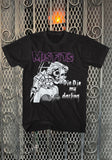 Misfits Die, Die My Darling black t-shirt featuring artwork from the album, displayed on a metal gate background.