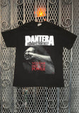 Pantera Cowboys/Vulgar black t-shirt featuring Vulgar Display of Power album artwork along with white text 'Pantera Cowboys from Hell' above the image, displayed against a metal gate background.