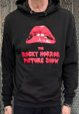 A person wearing a black pullover hoodie with a large red graphic of lips and the text 'THE ROCKY HORROR PICTURE SHOW' printed on the front.