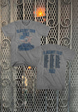 Front and back of Scorpions Blackout 1982 Tour heather grey t-shirt featuring the map tour artwork along with tour name and band name in blue text on the front and the tour stops and dates in blue text on the back, displayed on a metal gate background.
