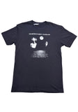 A black short-sleeve crewneck t-shirt featuring a white graphic print of the band The Sisters of Mercy / Floodland on the front, displayed flat against a white background.