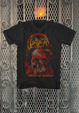 A black short-sleeve graphic t-shirt featuring the band Slayer and the album 'South of Heaven' with a skull design, displayed against a metal mesh gate background.