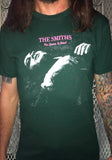 The Smiths The Queen is Dead green t-shirt featuring the album artwork, photographed on a model in front of a metal gate.