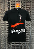 Suspiria Movie Poster black t-shirt featuring the imagery from the movie poster, displayed against a metal gate background.