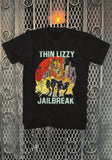 Thin Lizzy Jailbreak black t-shirt featuring the album artwork, photographed flat on a metal gate background.