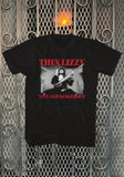 Thin Lizzy Live & Dangerous black t-shirt featuring album artwork, displayed on a metal gate background.